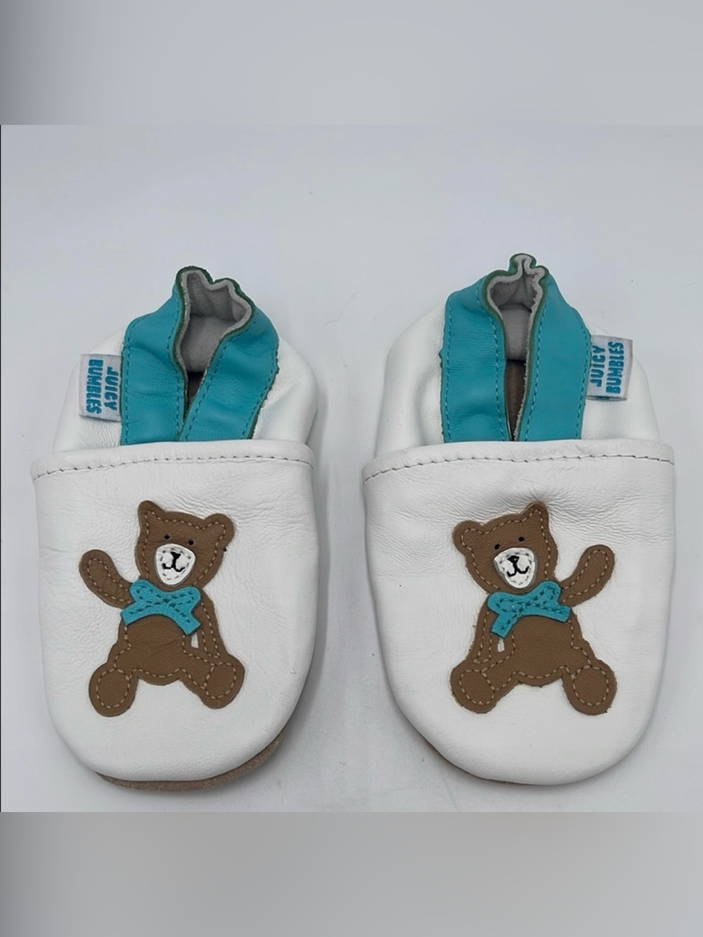 Soft Leather Juicy Bumbles Baby Sleepers White with Turquoise Band & Bear Design
